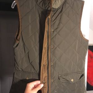 green vest with brown trim